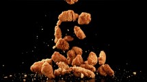 Chicken nuggets fly. Filmed is slow motion 1000 fps.