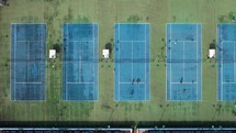 Tennis players play on the courts