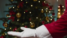 Santa Claus moving with open hand background 