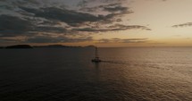 Aerial Drone shot of Sailboat On The Ocean At Sunset In Guanacaste, Costa Rica