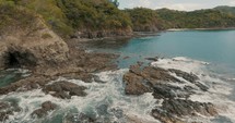 Aerial drone shot Flying Around Scenic Beach In Guanacaste Province, Costa Rica.
