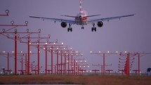 Commercial aircraft landing at twilight