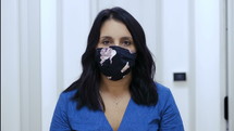 a woman wearing a face mask 