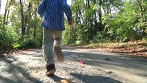 boy child running on an outdoors path 