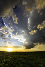 Setting Sun Lights Up A Spectacular Storm Cloud Over Beautiful Fields