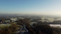 Winter scene over fields and roads

Wide arial shot over a frozen day in stockport, UK