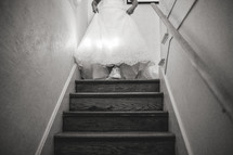 a bride walking down steps 