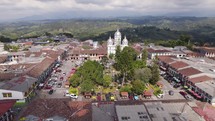 Colonial style Bolívar Park in Filandia Quindio, Colombia, aerial orbit daytime