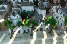 Miniature scale model of alberobello in puglia, italy, representing the village with its typical white trulli houses