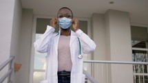 A female healthcare worker wearing a mask