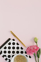 polka dot notebook, pink carnation, gold paperclips 