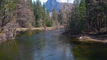  Pan Up Shot of Merced River and Half Dome Mountain