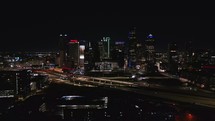 Forward Drone Shot of Dallas City Skyline at Night	