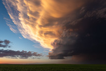 Bright Sunset Colors Fill The Sky As A Big Storm Drifts By