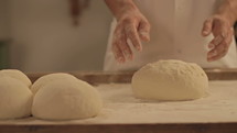A baker prepares fresh breads and cakes. Shot in Cinestyle color profile  (good for color grading).