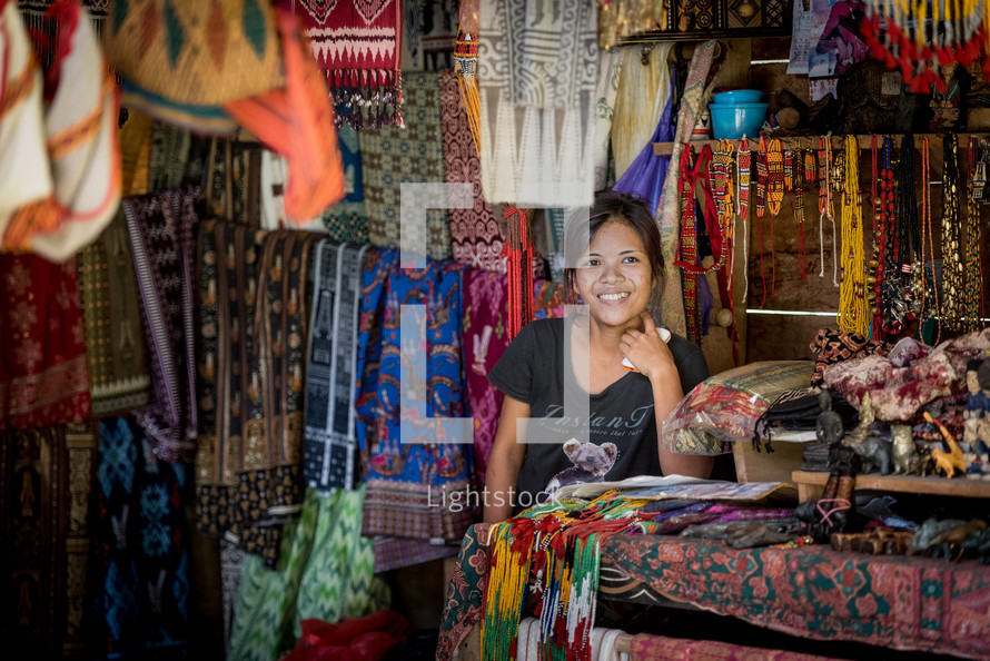 vendor selling fabrics in a market 