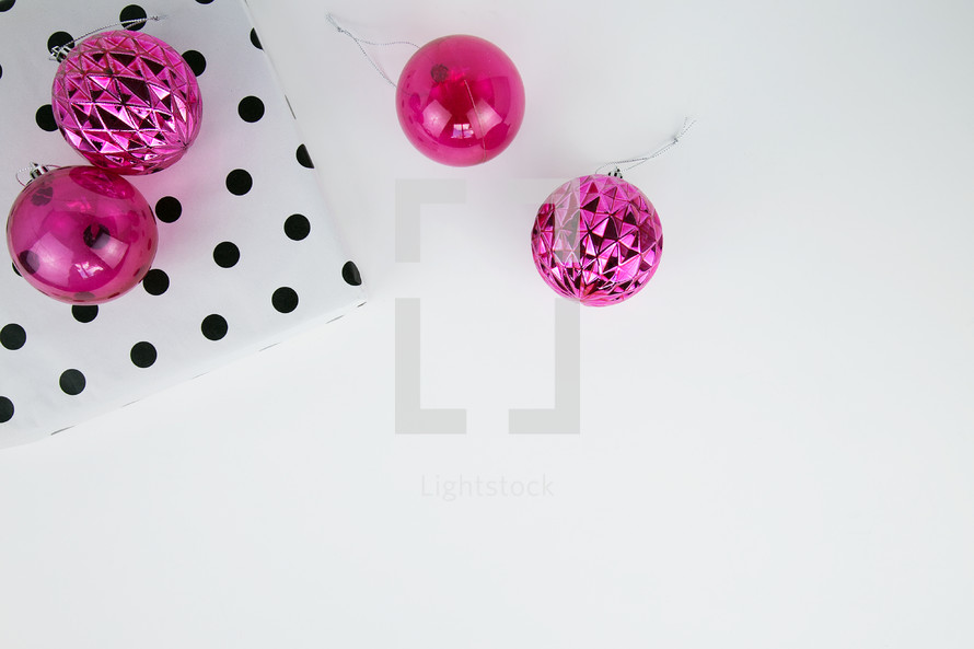pink ornaments and black and white polka dot wrapping aper 