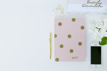 2017 planner and cellphone on a desk 