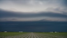 Stormy Shelf Cloud Turns the Sky Dark Above Beautiful Farm Land.