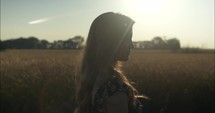 Sun light shines on young woman in slow motion.