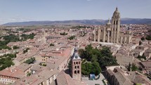 Drone view of impressive Segovia cityscape, countryside backdrop
