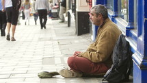 Man sitting on the street.