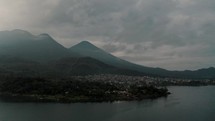 Panoramic View Of Santiago Atitlan Village In Guatemala At Sunrise - aerial drone shot	