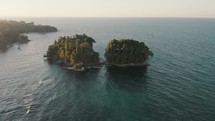 Remote Tropical Island off of Punta Mona coast; epic drone view during sunset	
