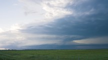 A Large Storm Slowly Moves Closer as it Spins Across the Plains.