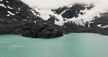 Glaciar Vinciguerra And Laguna de los Tempanos In Ushuaia, Tierra del Fuego, Argentina. drone pullback shot