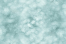 Blue, green, and white bokeh blend effect - abstract background