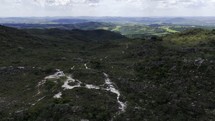 Drone flies over hiking trail in Brazil mining town
