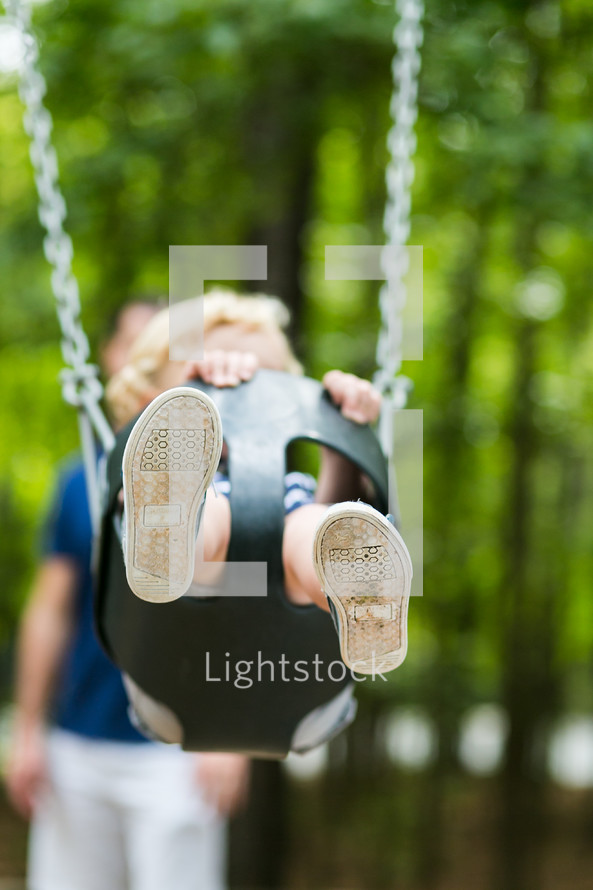toddler on a swing 