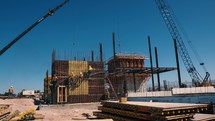 Timelapse of construction workers setting forms and rebar