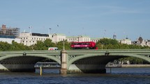 LONDON, UK - CIRCA OCTOBER 2022: Red double decker bus on Westminster Bridge - EDITORIAL USE ONLY