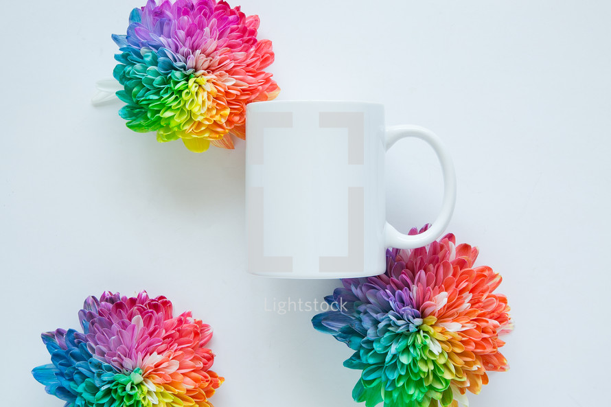 rainbow flowers and a white mug 