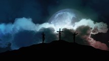 Silhouettes of three crosses on top of a hill at midnight. Concept of the Crucifixion of Christ.
