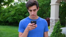 young man messaging on his phone 