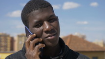 a young man talking on a cellphone 