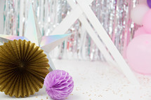star, gold, and purple paper party decorations 