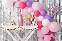 balloon arch and champagne 