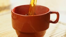 pouring coffee into a mug