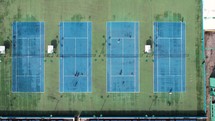 People on the tennis courts