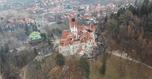 Aerial view around castle on foggy day in Romania.