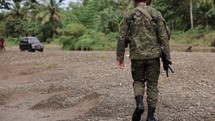 Asian Man Walking With Gun Soldier Warfare