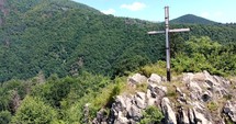Wooden cross on top of a mountain in Romania.
