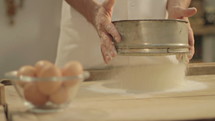 A baker prepares fresh breads and cakes. Shot in Cinestyle color profile  (good for color grading).