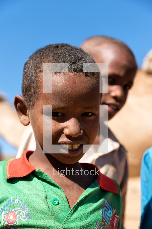 boys in Ethiopia with camels 