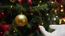 Santa preparing Christmas tree decorations