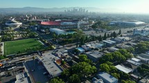 Cinematic view of the LA Coliseum, the surrounding stadiums, and Downtown Los Angeles.